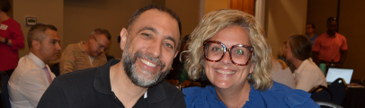 Group photo of two people smiling
