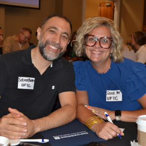 Group photo of two people smiling
