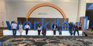 Group photo of Empowering UF's leadership team in front of Workday logo